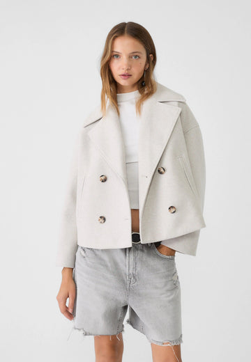 Kort double-breasted jack met oversized revers en zakken